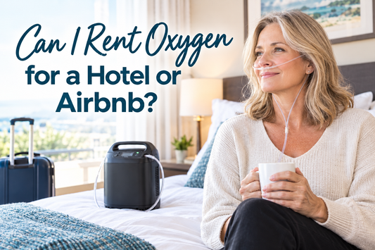 Woman wearing a nasal cannula using supplemental oxygen from a portable oxygen concentrator in a hotel room while traveling, with luggage nearby