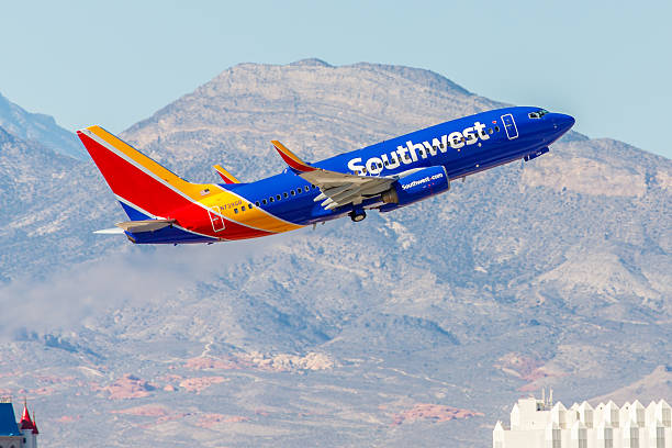 Southwest airplane flying against a mountainous background